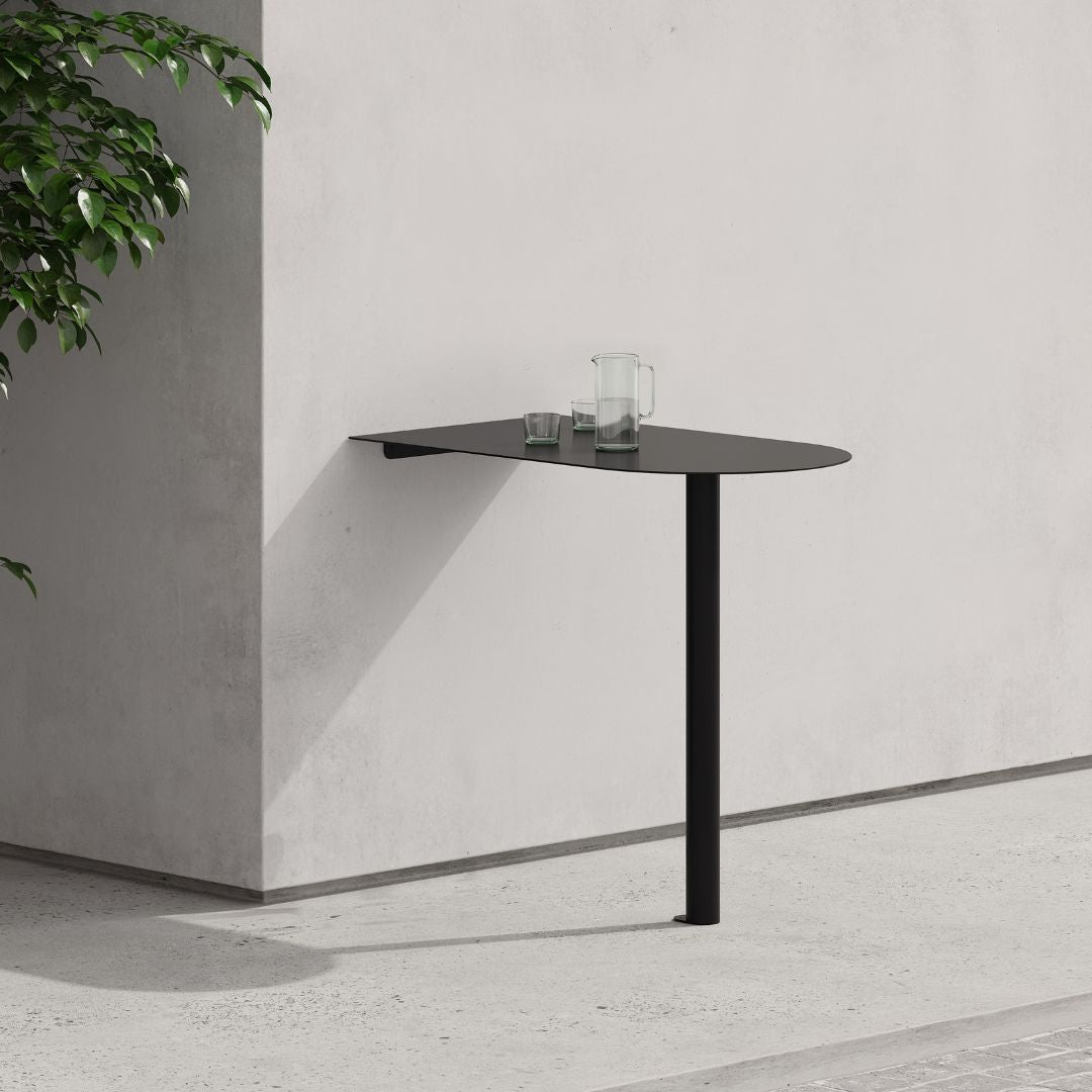 Minimal black aluminum booth restaurant table mounted to wall in slim profile