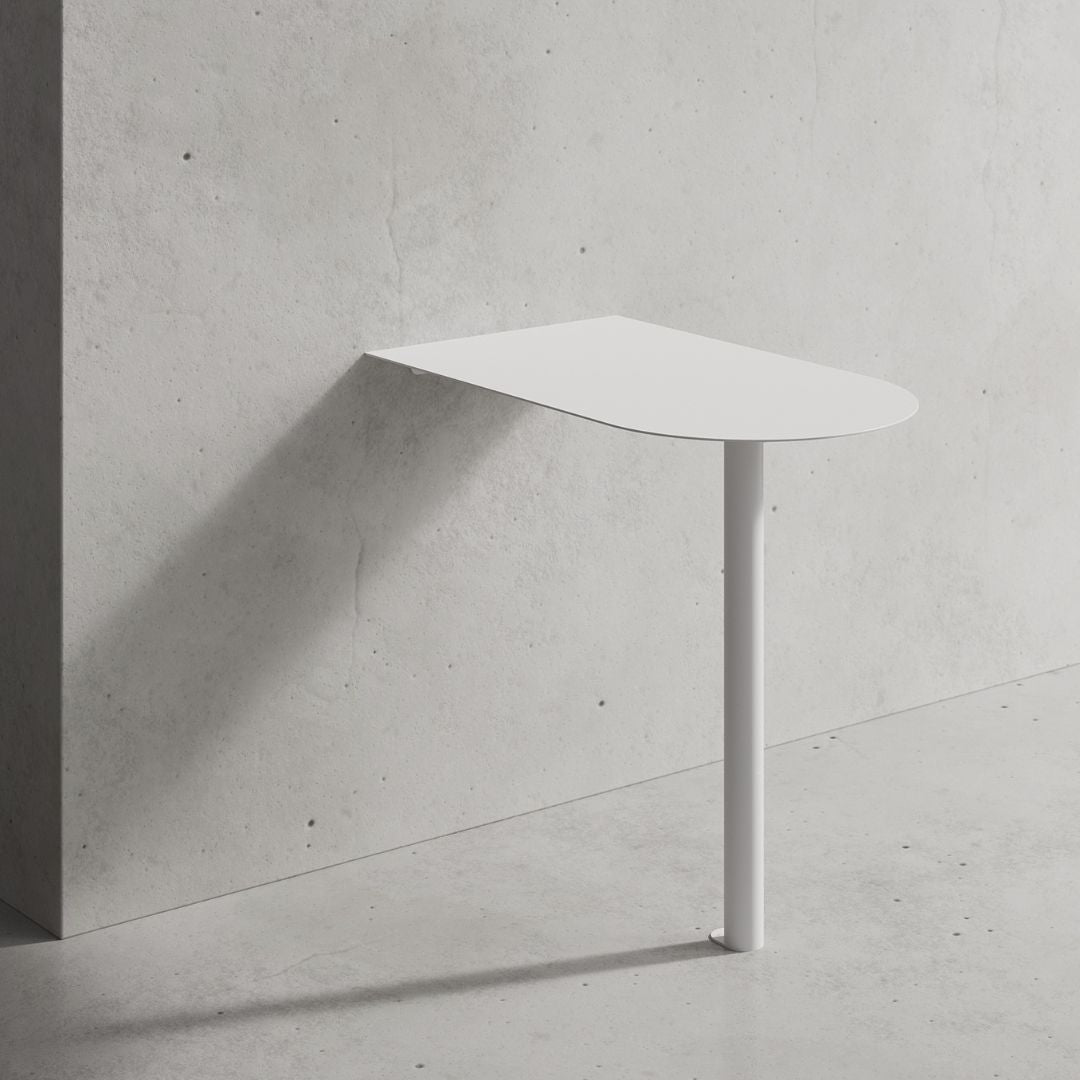 Compact booth cafe table mounted to wall, showing clean space-saving design