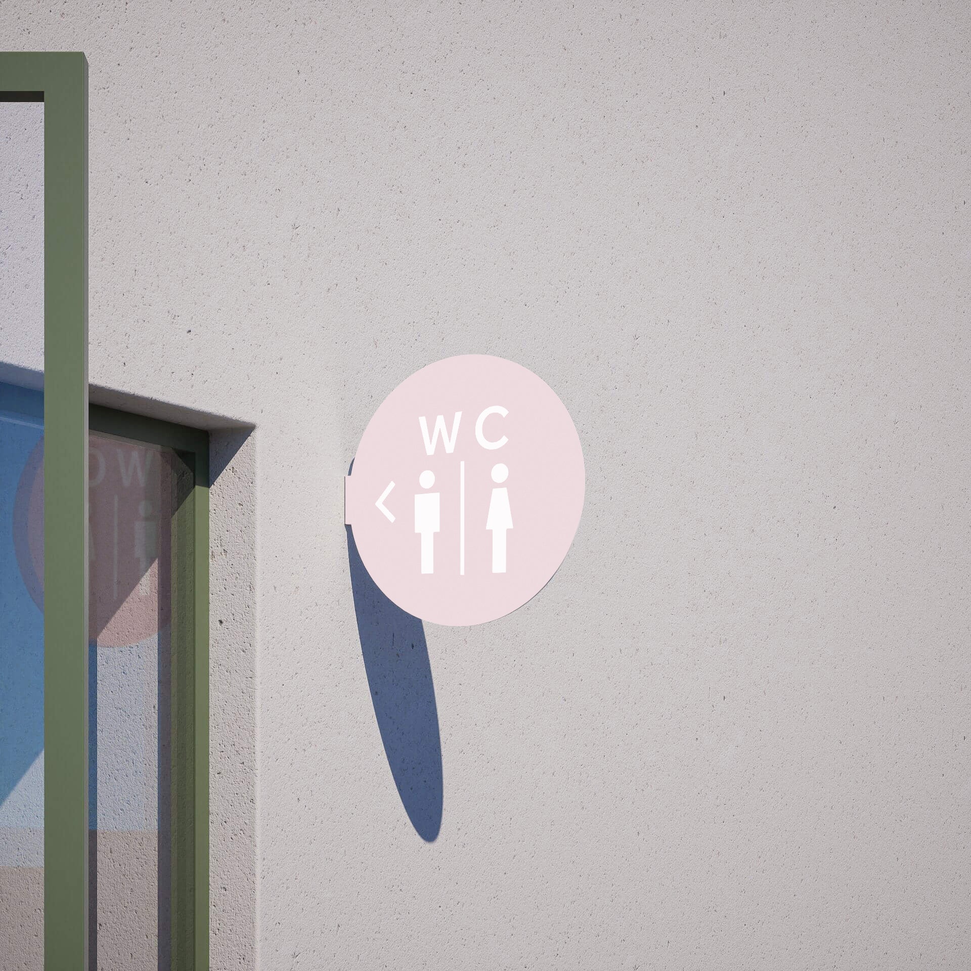 pink circle blade wall sign with toilet decal applied to be a bathroom sign, installed on a wall