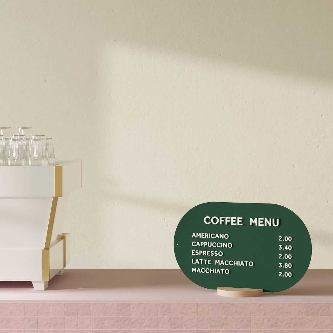 forrest green curve tabletop menu display with white magnet letters on a countertop