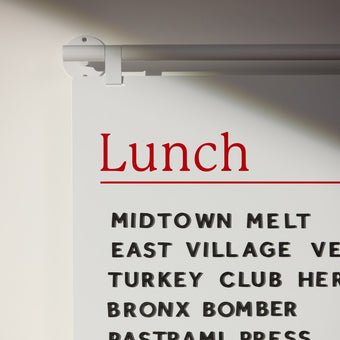 close up of white handing menu board showing hook details