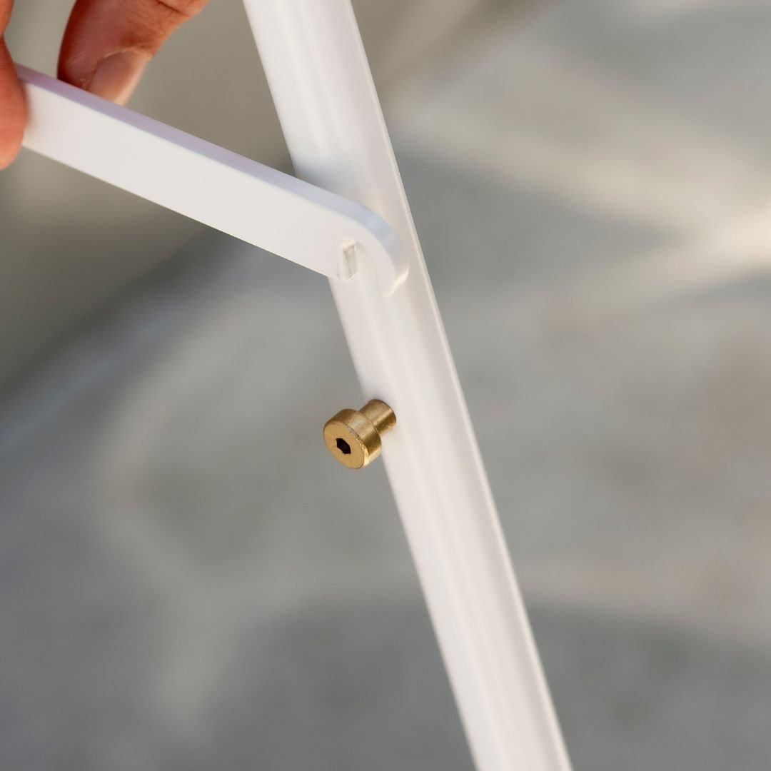 close up of brass joinery and bolts on large letter sidewalk sign