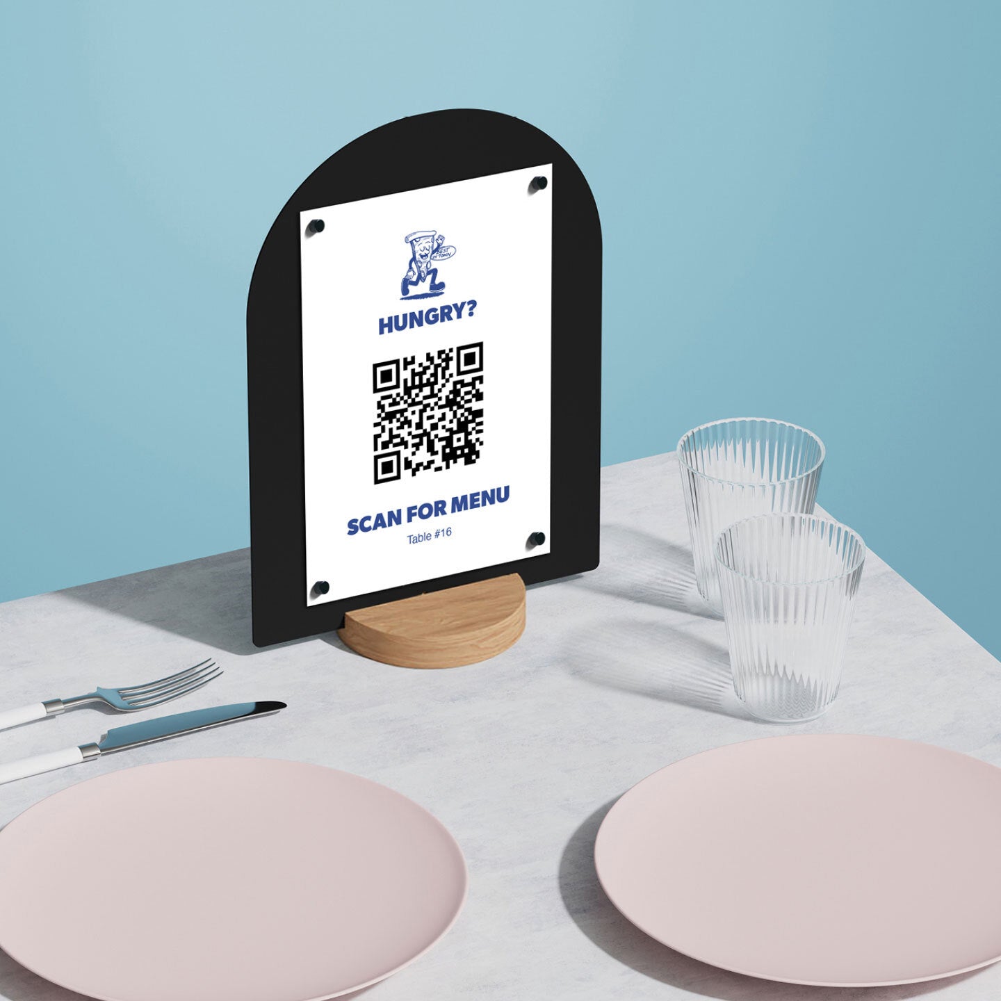 black large round table talker with QR code attached at a table