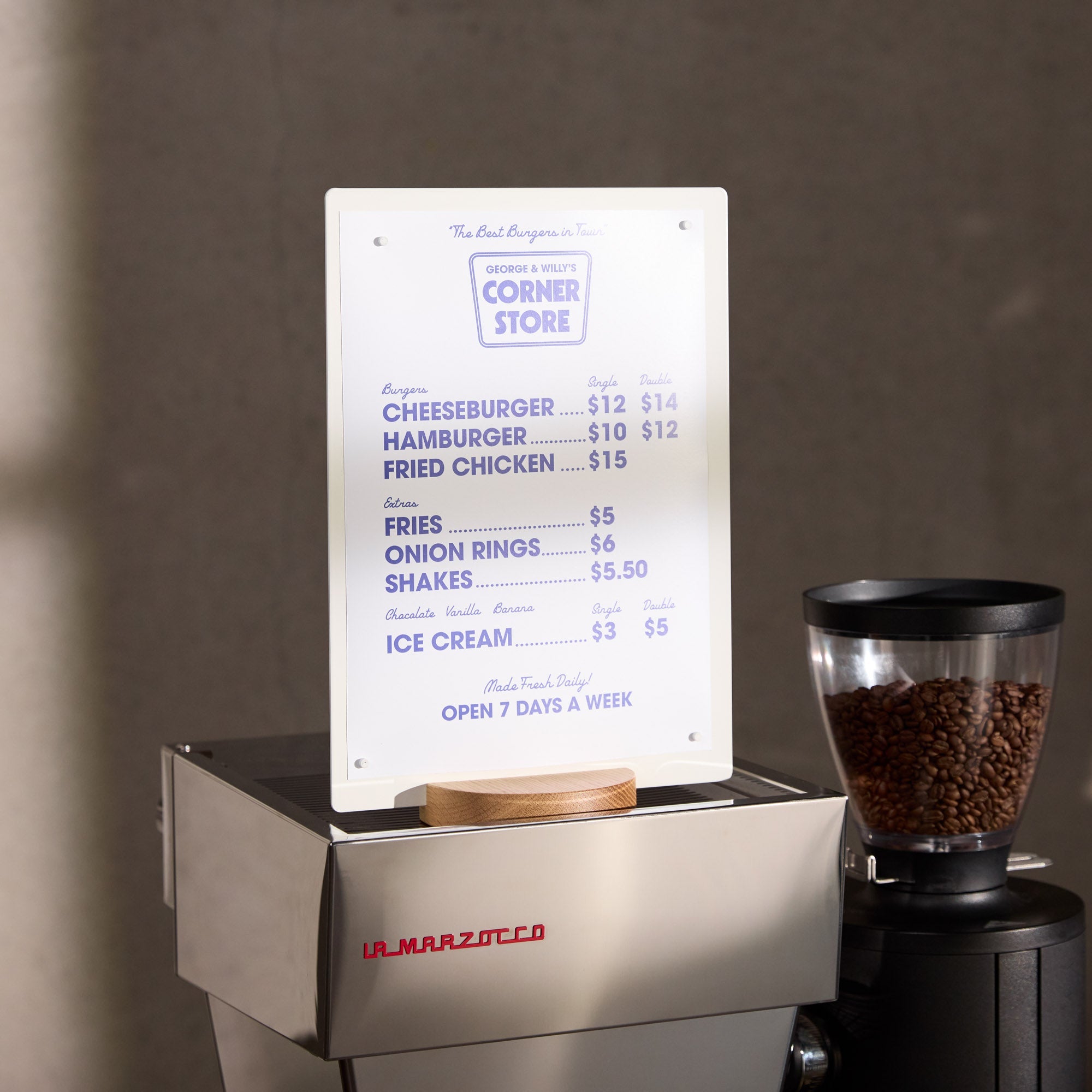 large white table talker on top of a countertop beside coffee beans