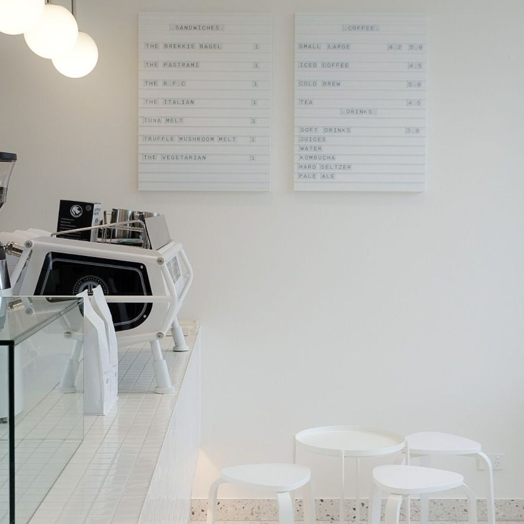 two letter menu boards installed in a restaurant cafe behind the countertop
