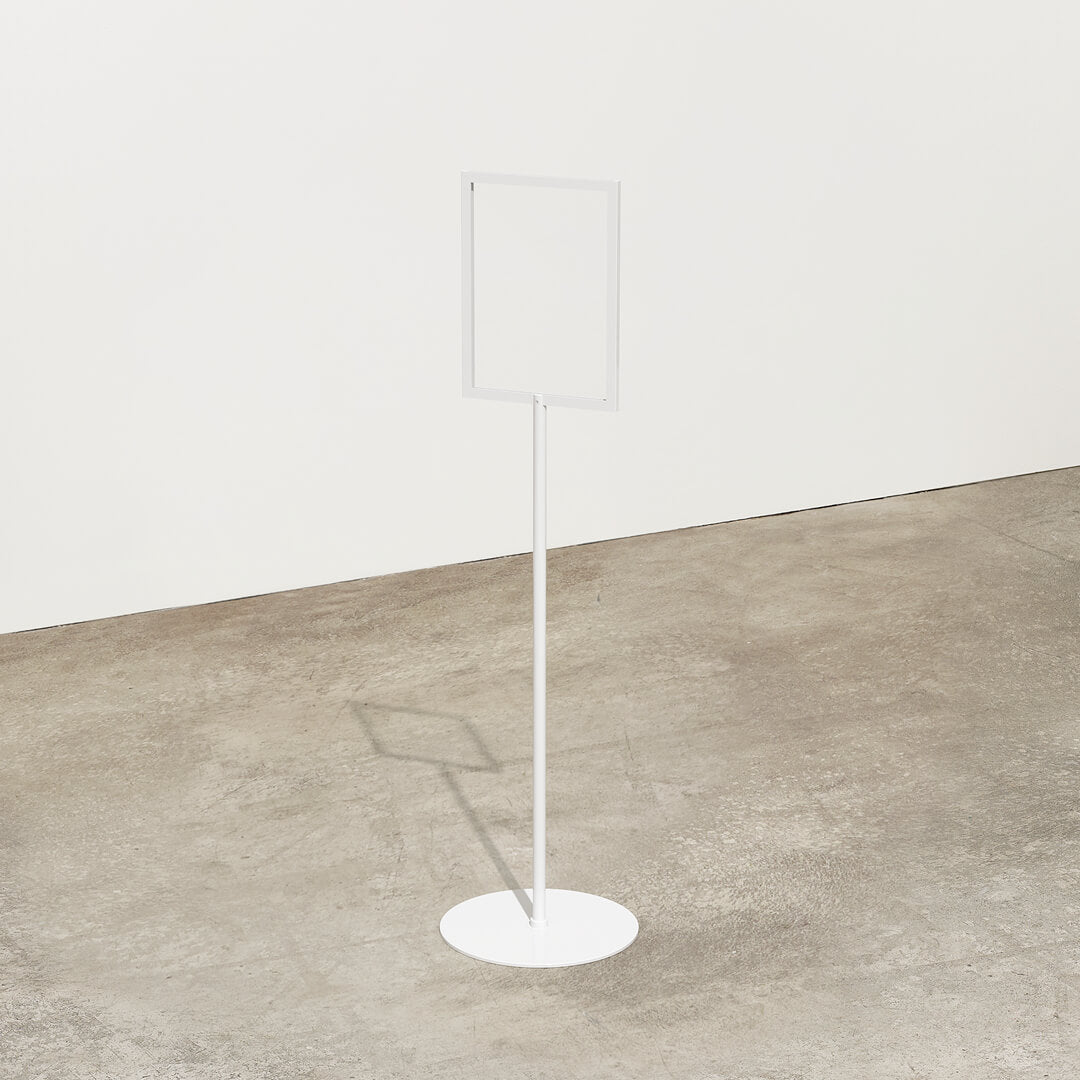 white metal standing sign holder with no message displayed in a studio
