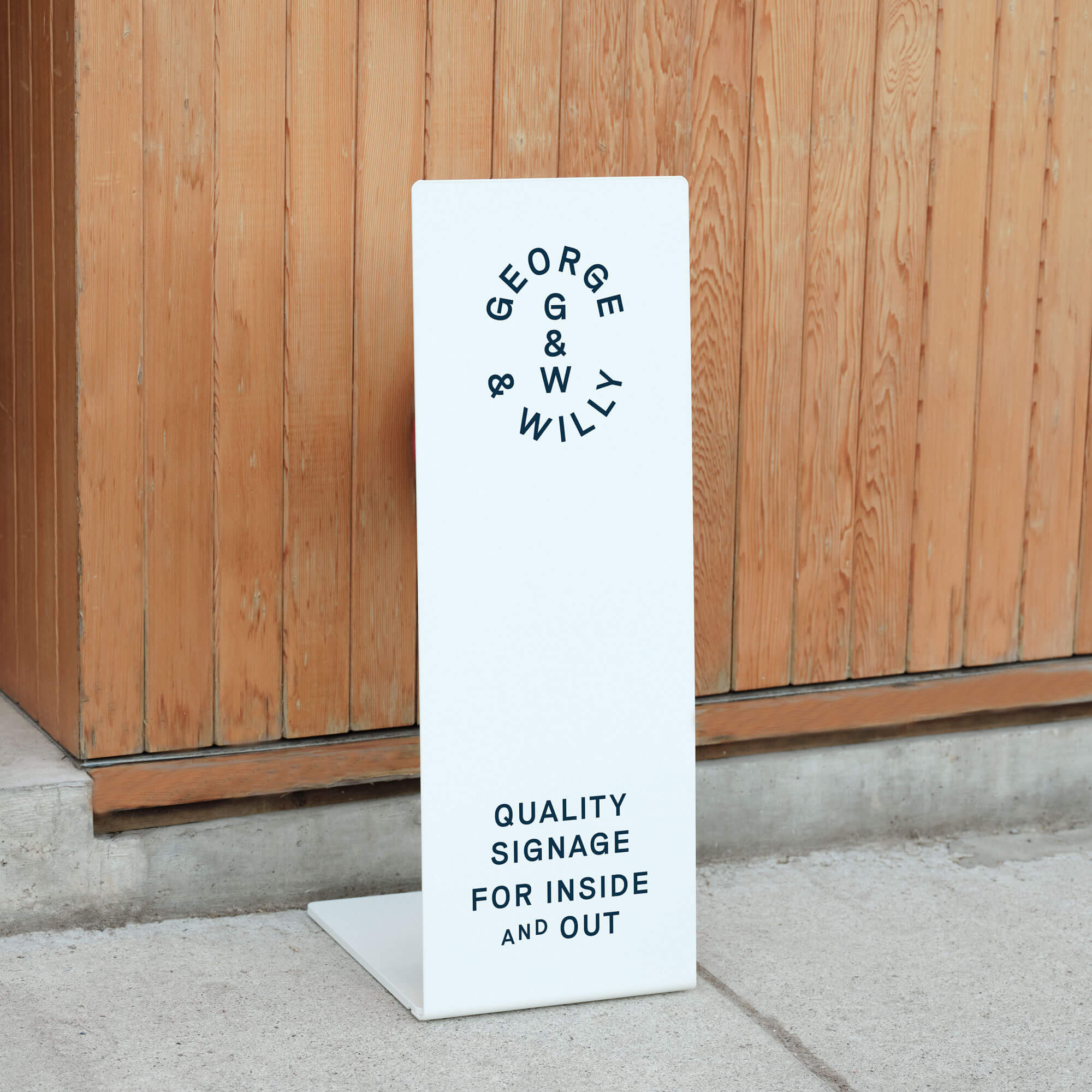 white welcome business sign with blue logo branding