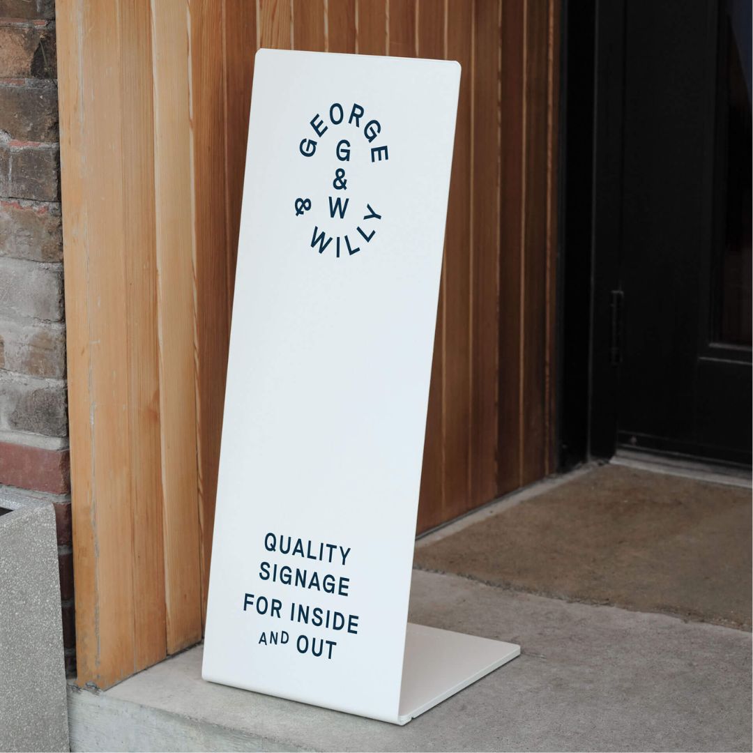 white metal entranceway signage as a welcome sign