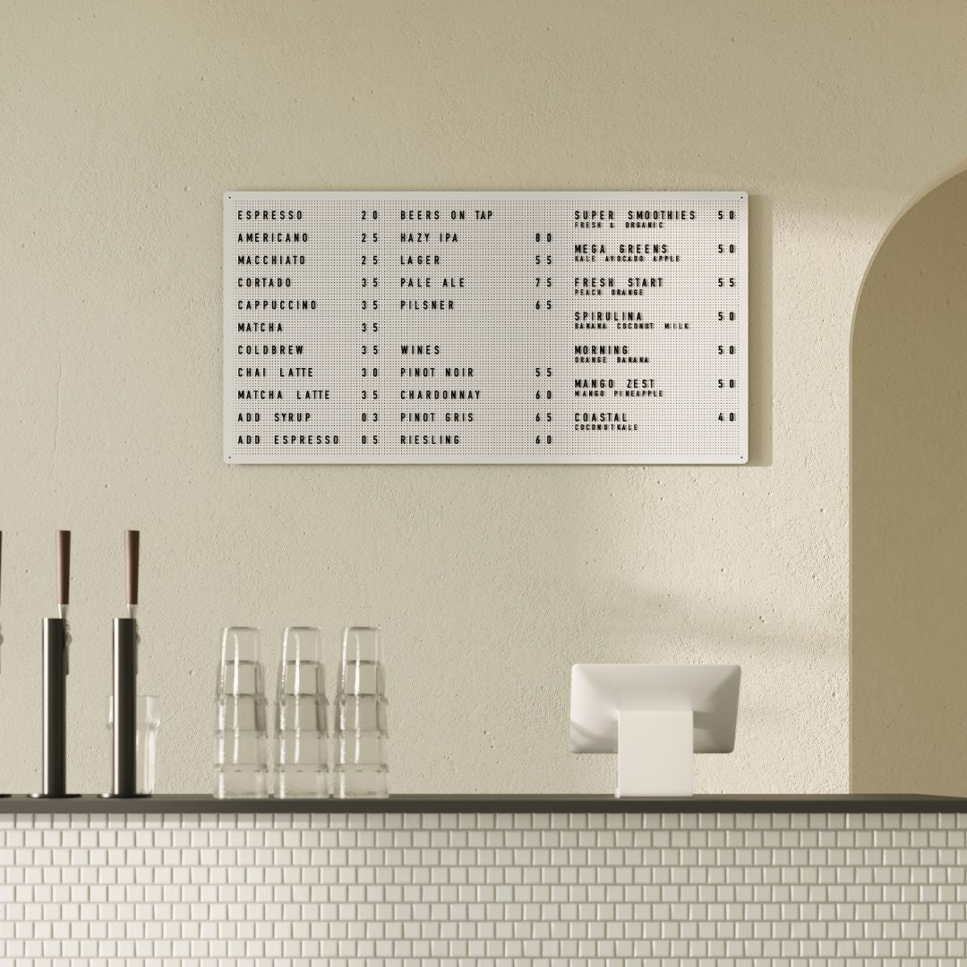 Large steel white peg letter board with menu display, wall-mounted in modern café interior