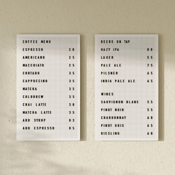 Pair of white peg letter boards displaying café menu, mounted on wall