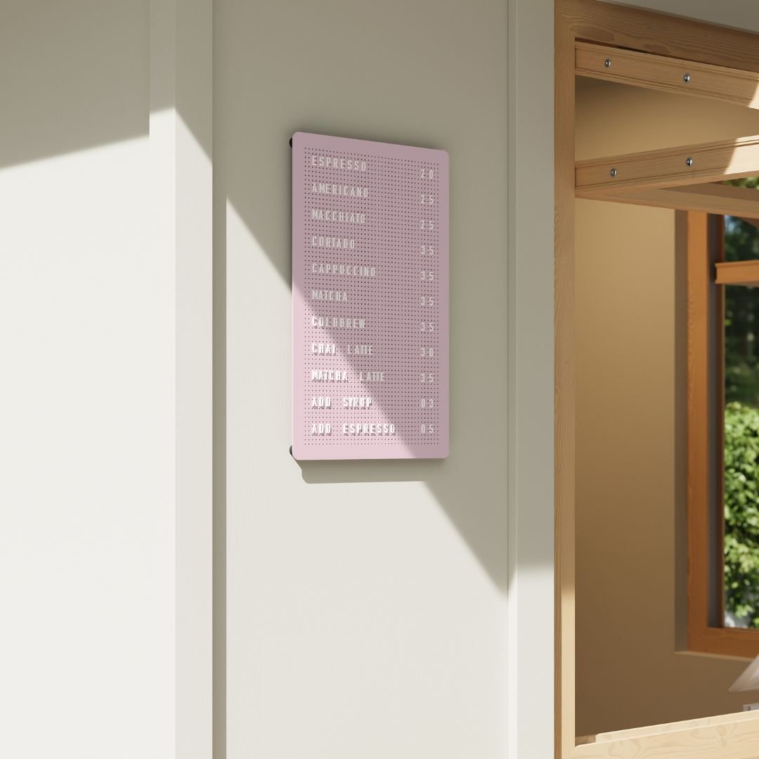 pink peg letter board small on a minimal cafe window