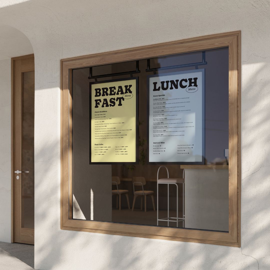 white black poster hanging menu boards installed to display in a cafe window