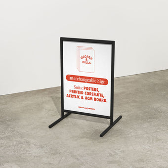 black framed poster sidewalk pavemen sign inside a studio