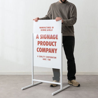 white frames poster sidewalk pavement sign with person inserting poster