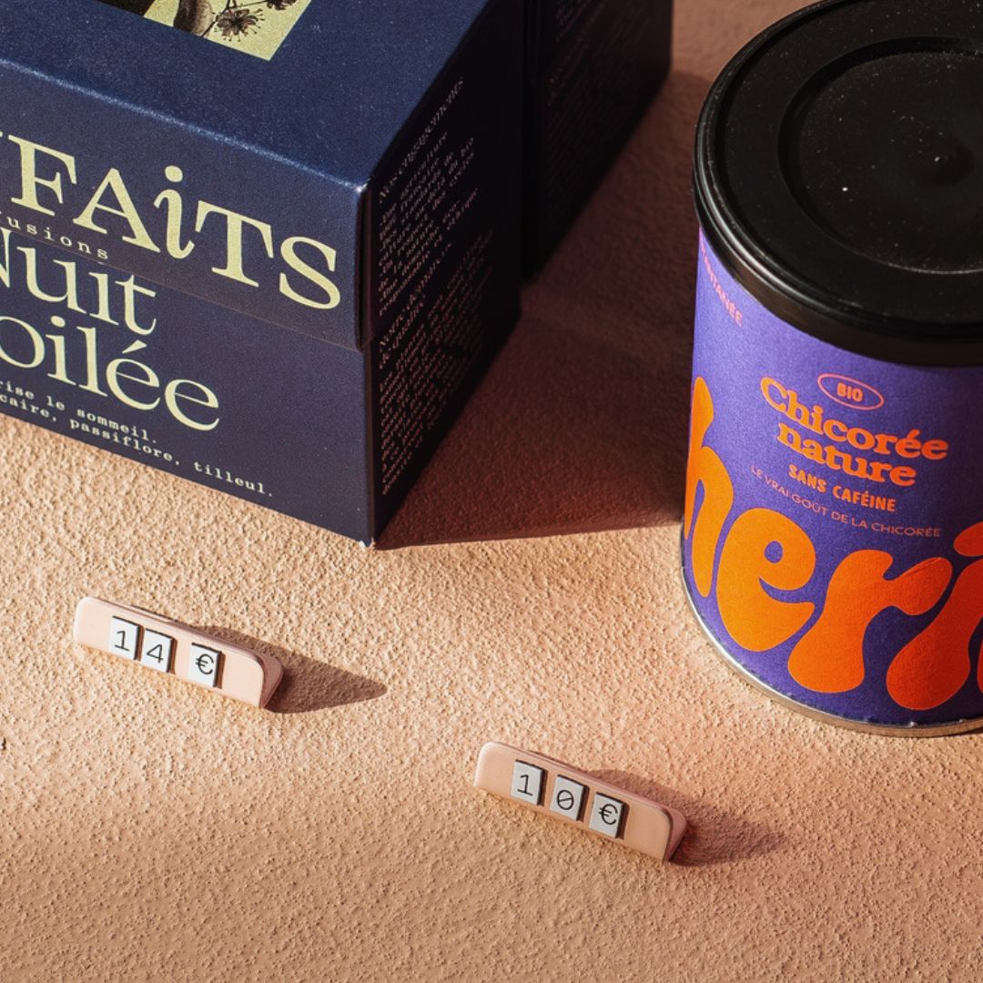 two pricing signs in front coffee apparatus