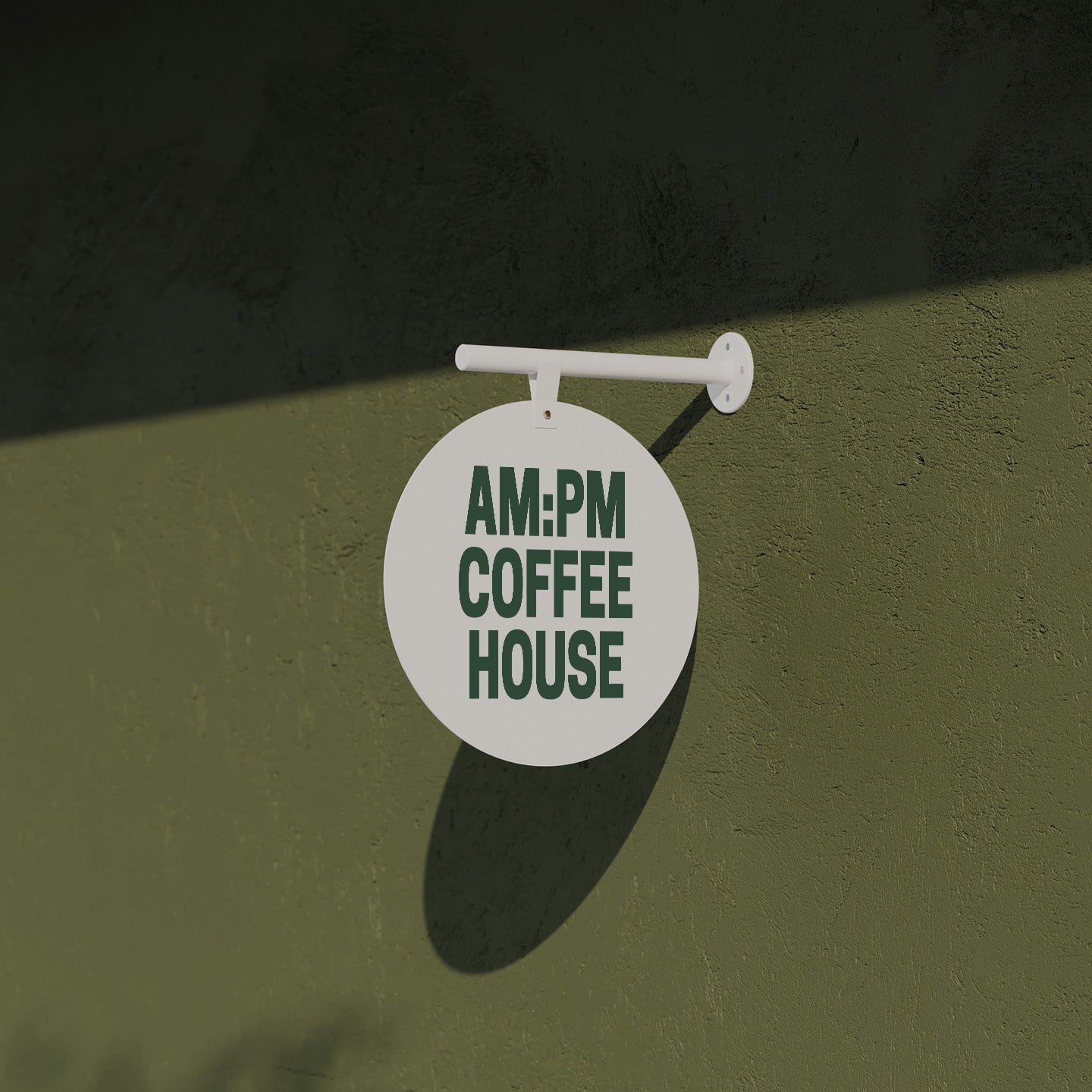 close up of the white wall hanging round sign on a green brick facade outside a coffee shop