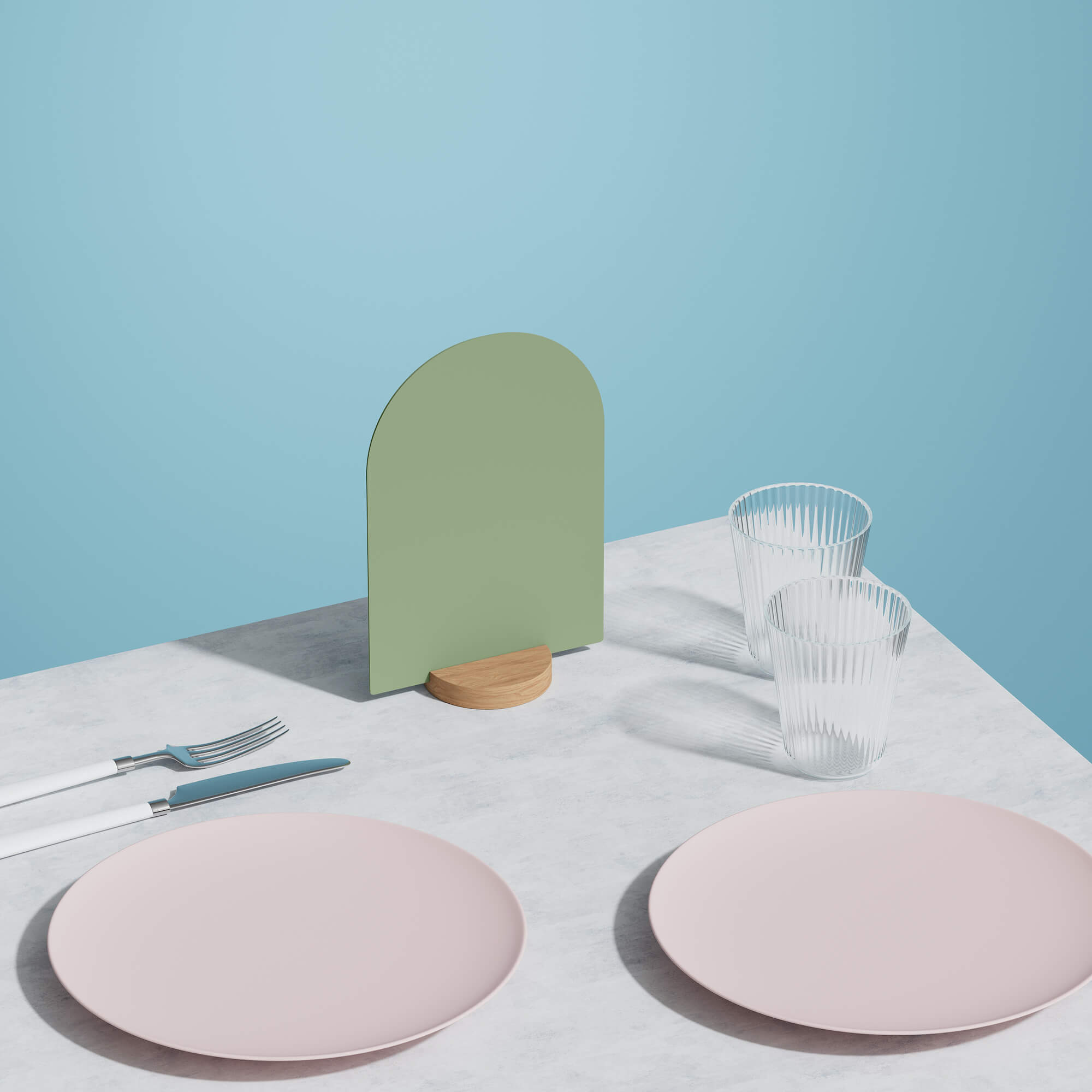 blank green table talker on a table beside two pink plates