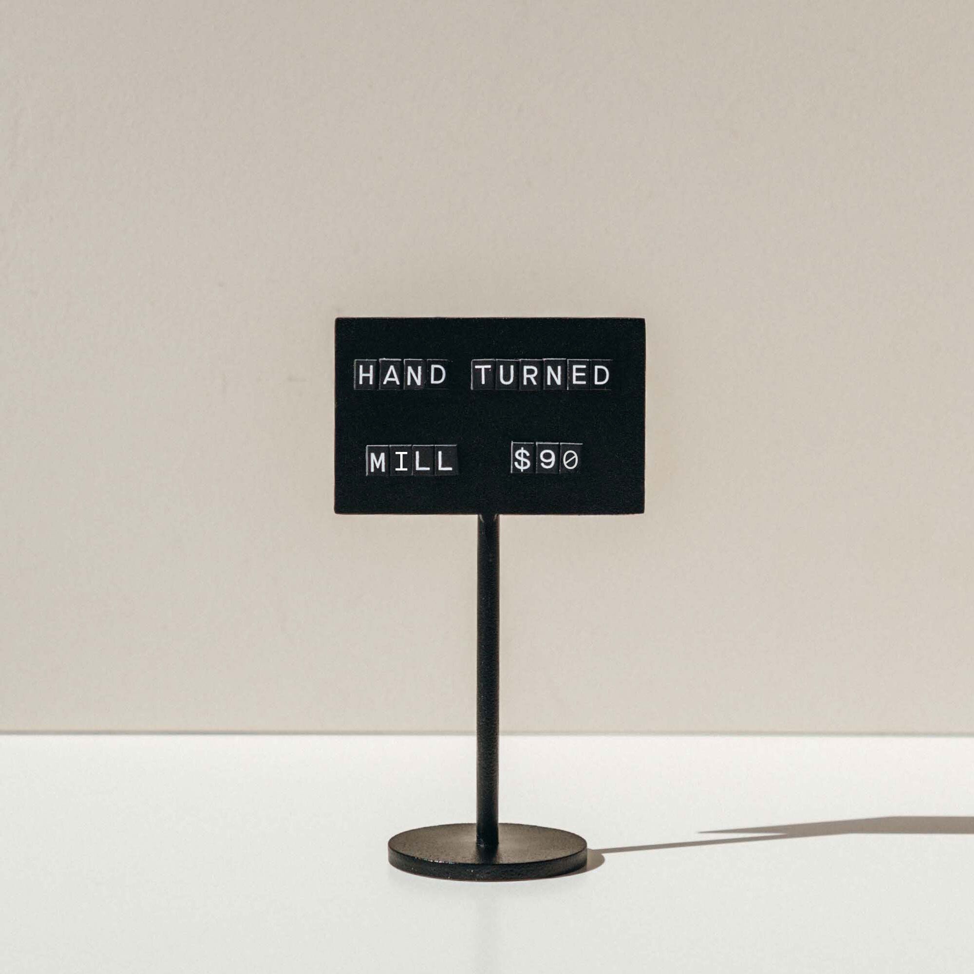 black standing counter sign on a countertop