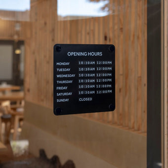 Black steel open office hours advertising sign for window displaying business hours of operation