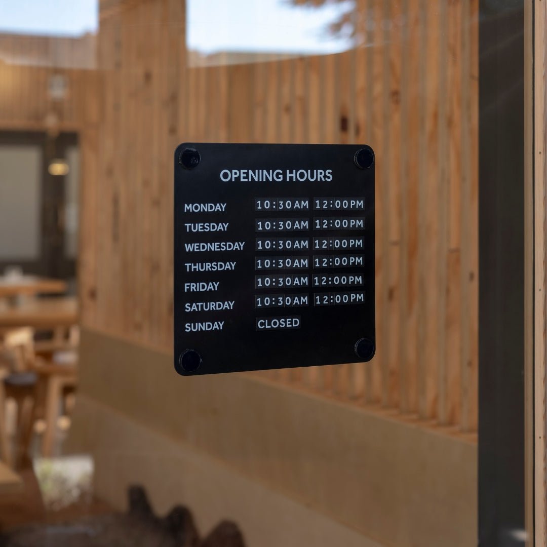 Black steel open office hours advertising sign for window displaying business hours of operation