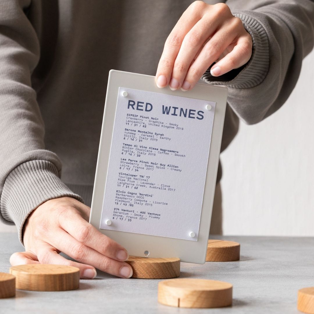 close up of person assembling a table talker into the base