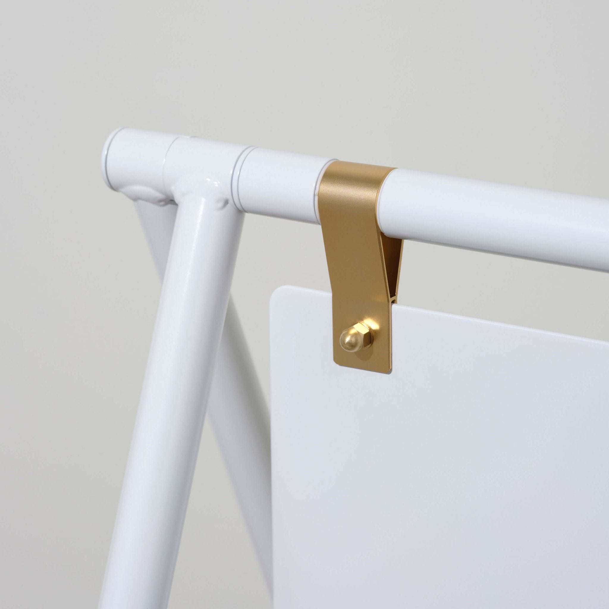 Close-up of blank white a-frame sandwich board sign gold hinges and aluminium frame construction