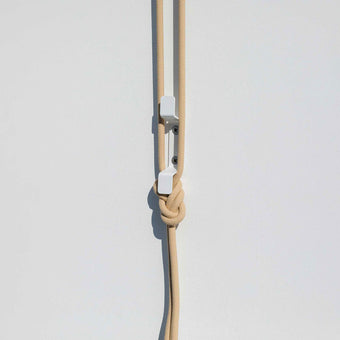 close up of ceiling hanging drying rack rope and cleat installed on wall