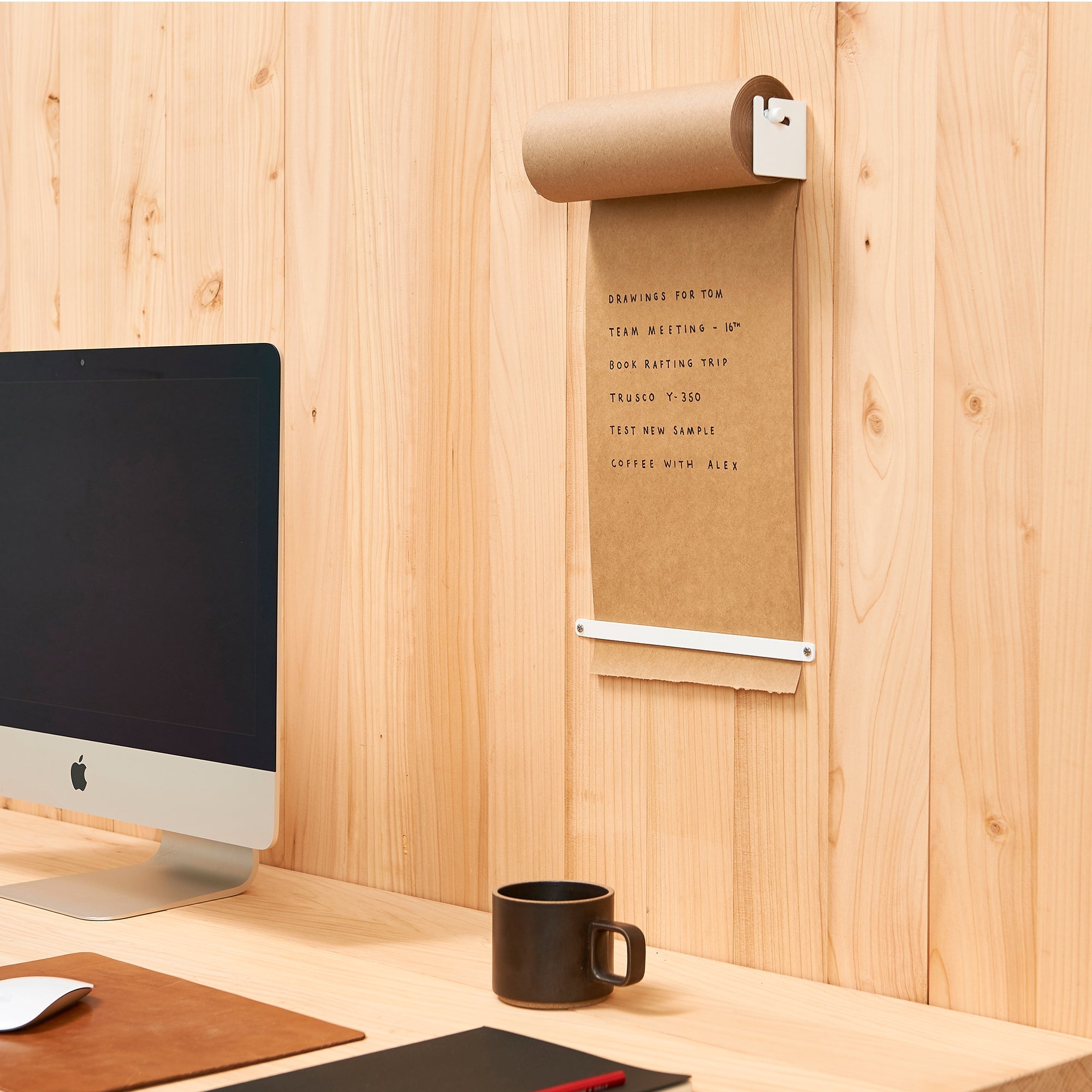 daily paper roll dispenser installed by a laptop in an office