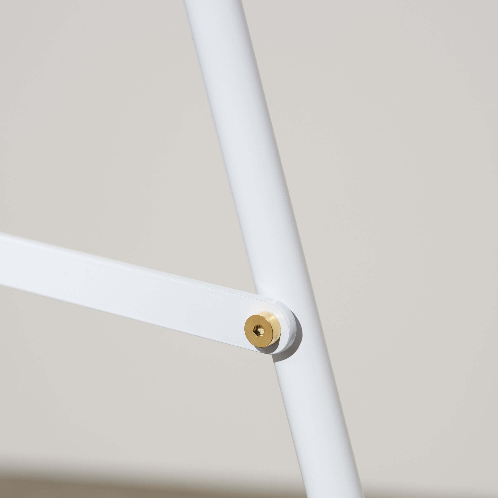 close up of the white sidewalk advertising pavement sign showing bolts and joinery