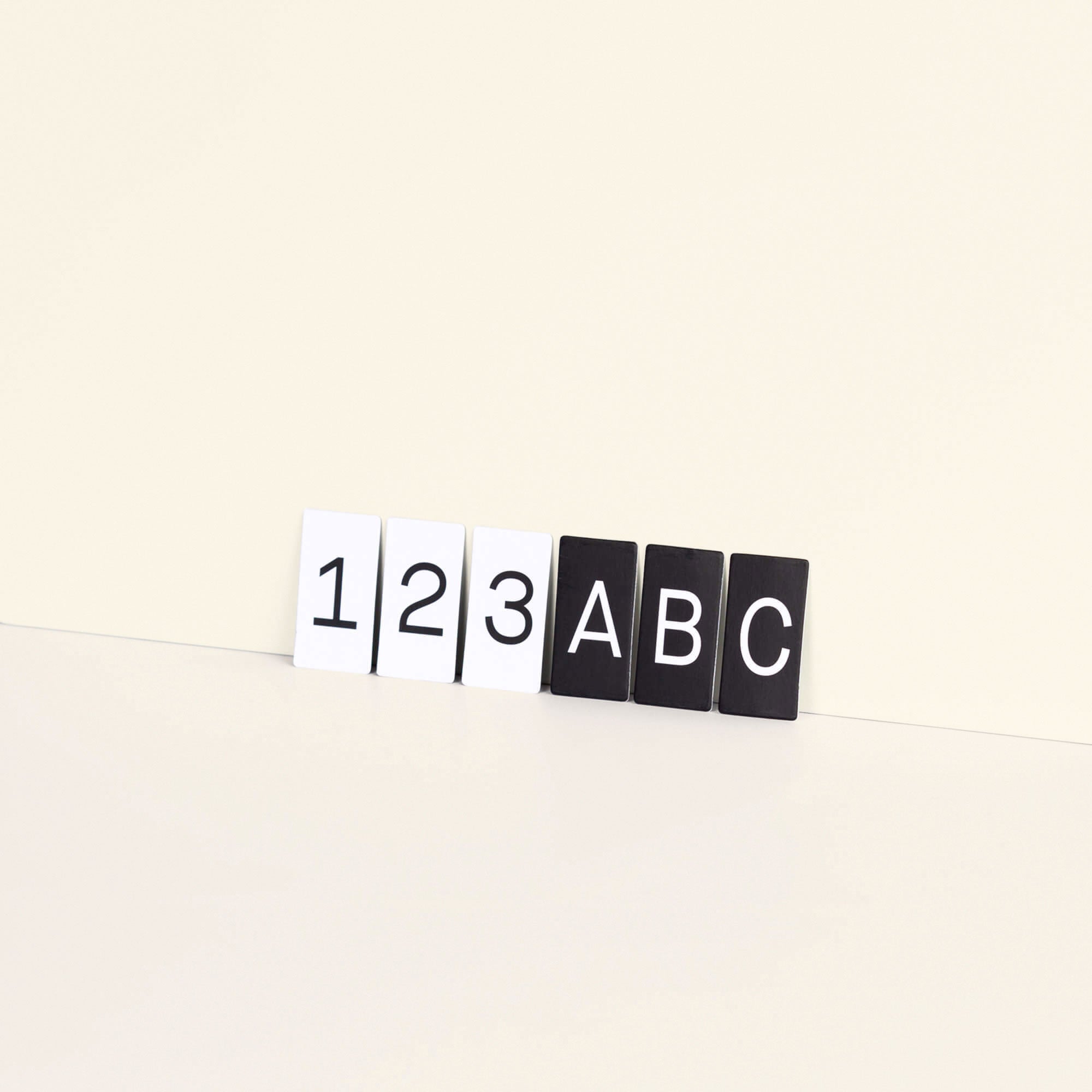 6 tiles of letters, 3 of each colour to show the colourways