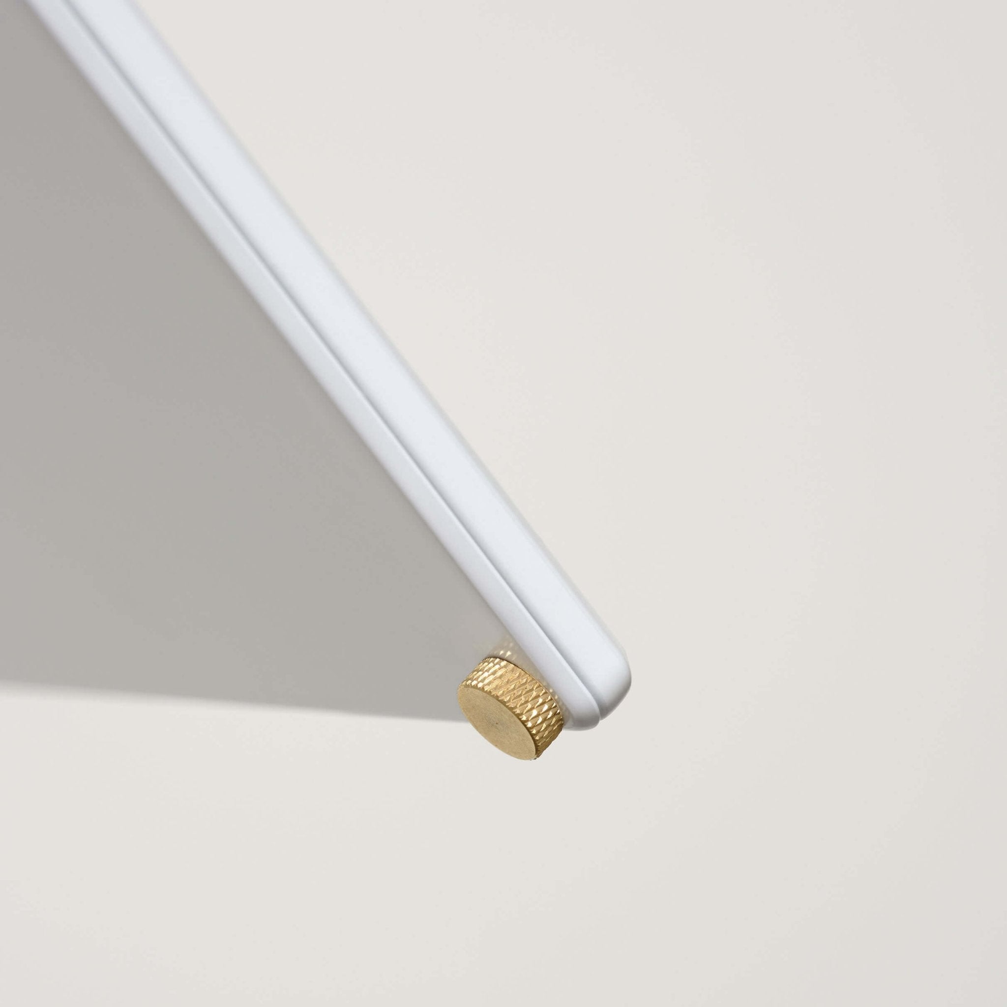 close up of brass bolts used to open and close the menu stand