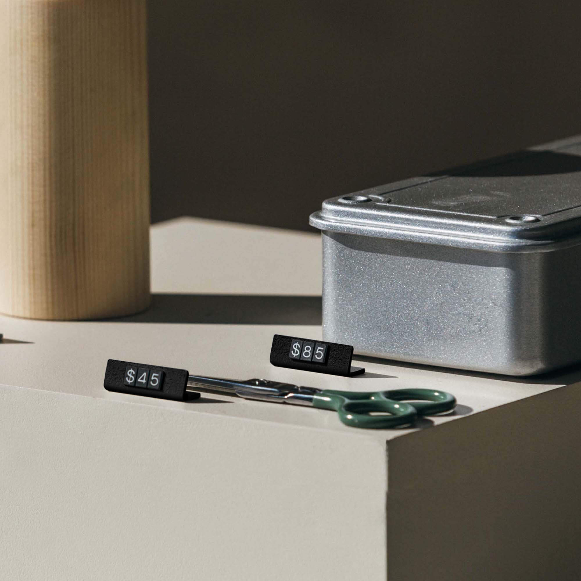 black pricing tags on a countertop