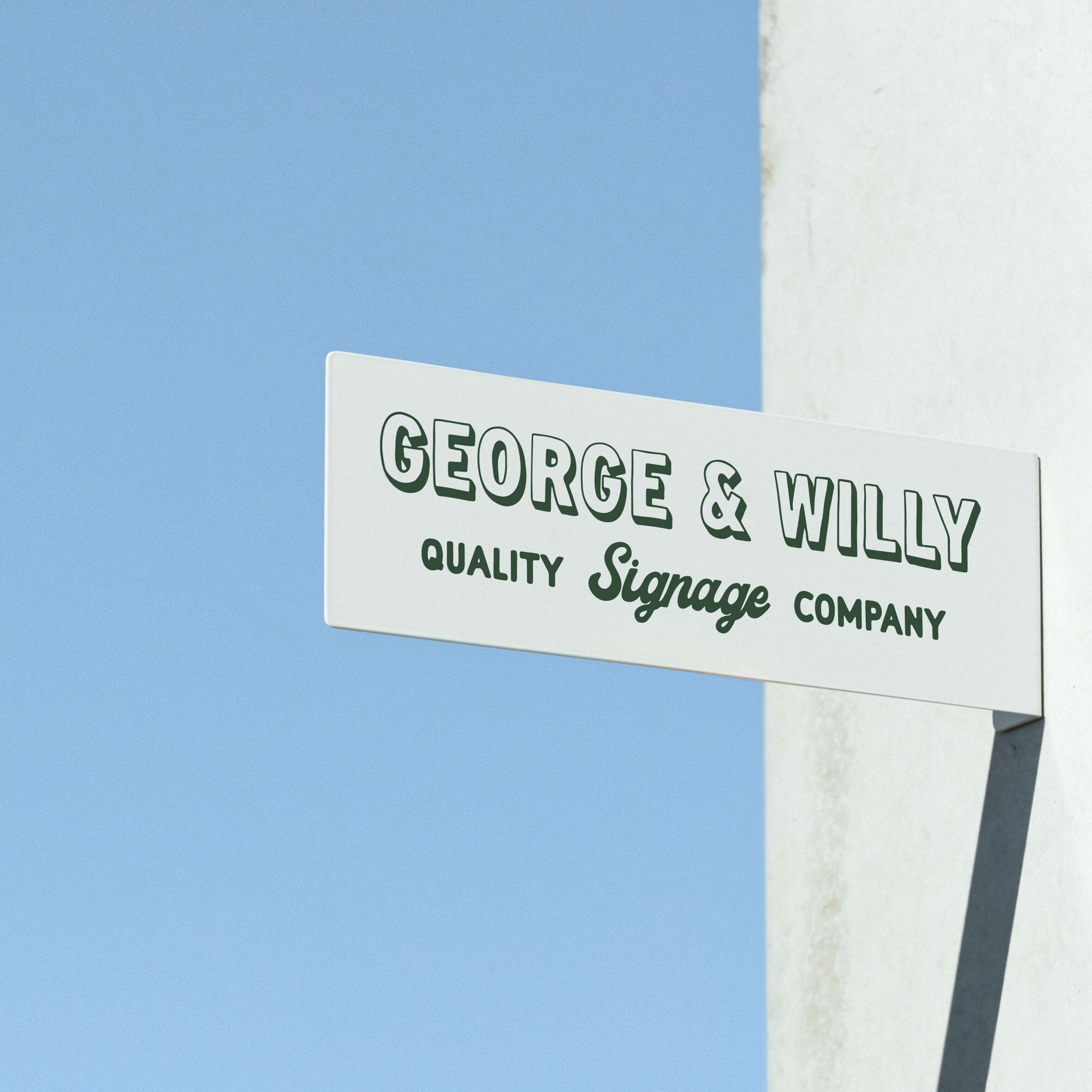 white rectangle blade sign installed on a wall with george & willy branding applied