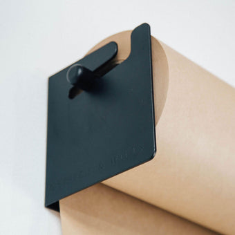 close up detail of the kraft paper in the studio roller holder