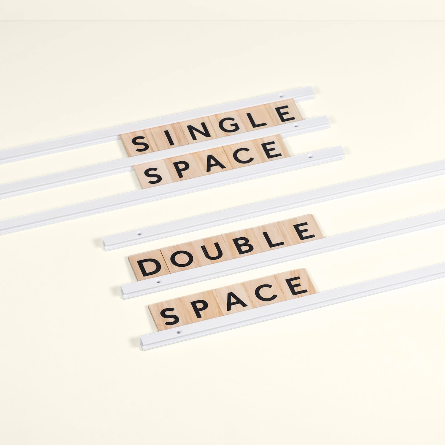close up of white rails with wooden letters