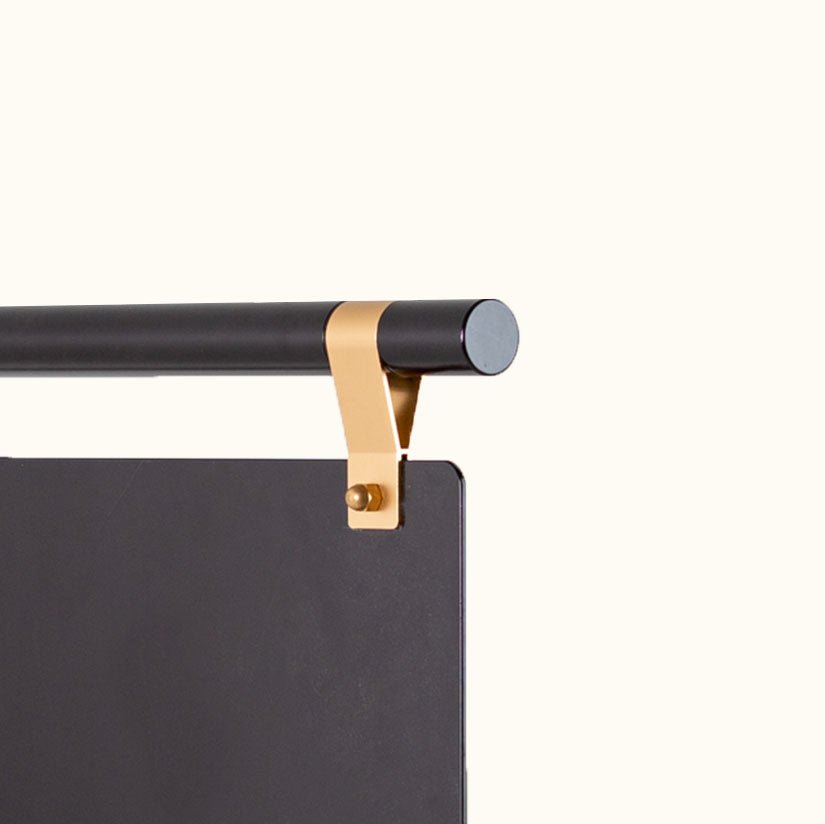 close up of brass detailing optionably used on the black hanging storefront shop sign