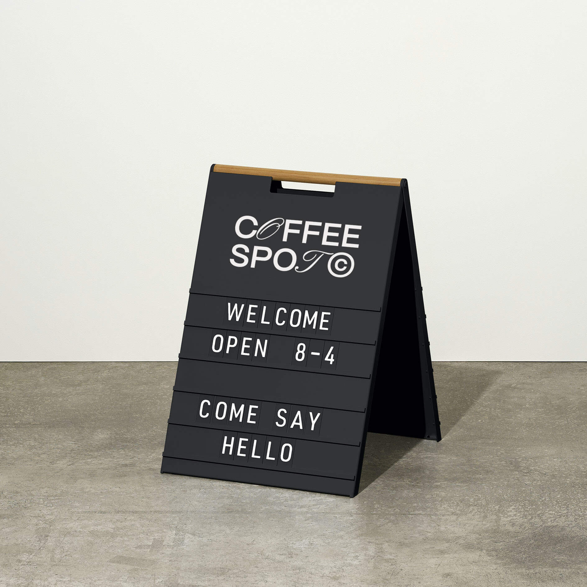 black letter sidewalk pavement sign inside a studio with message displayed